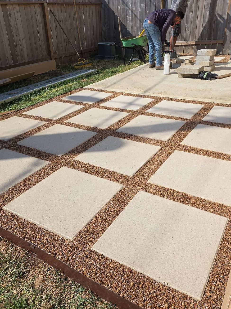 A paver patio laid into a lawn